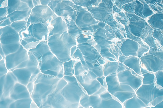 Texture of water in swimming pool for background