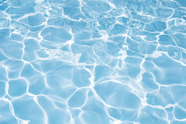 Texture of water in swimming pool for background