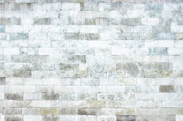 Texture of white marble blocks, bright stone wall as a background