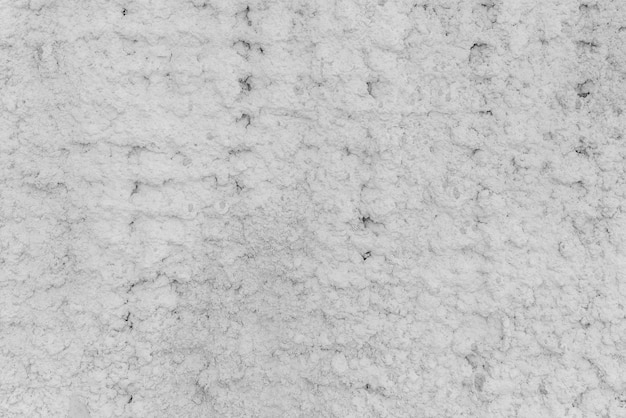 Texture of white plaster. Rough wall of the building.