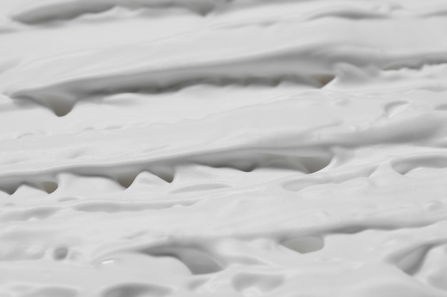Foto texture di schiuma da barba bianca come sfondo vista dall'alto