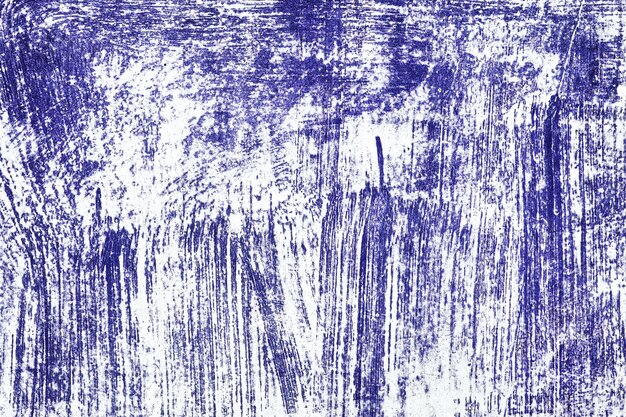 Photo texture of white surface with scratched inky blue paint shabby grunge background