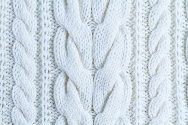 The texture of white yarn. Knitted and winter clothes 