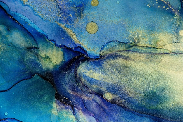 texture with gold painting made in the technique of alcohol ink