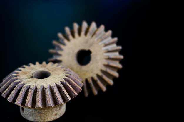 Texture of wooden gears on a black background mechanism