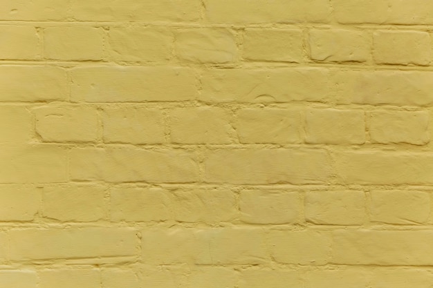 黄色いレンガの壁の質感。バックグラウンド。テキスト用のスペース。