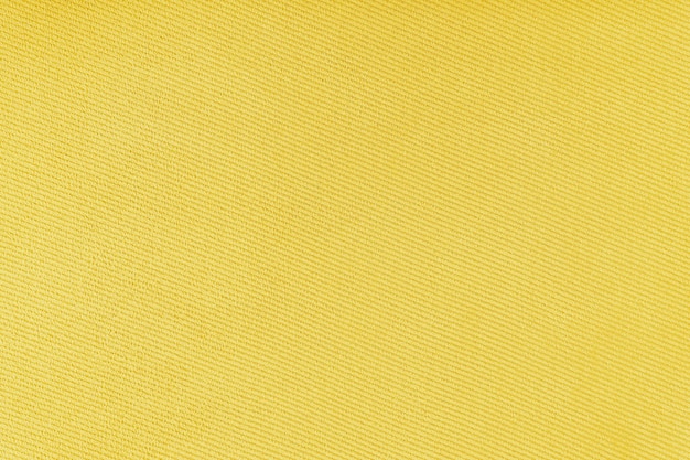 Texture of yellow fabric diagonal weave pattern Decorative textile background