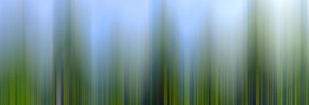 Photo textured abstract blurred background with vertical stripes of different shades of green