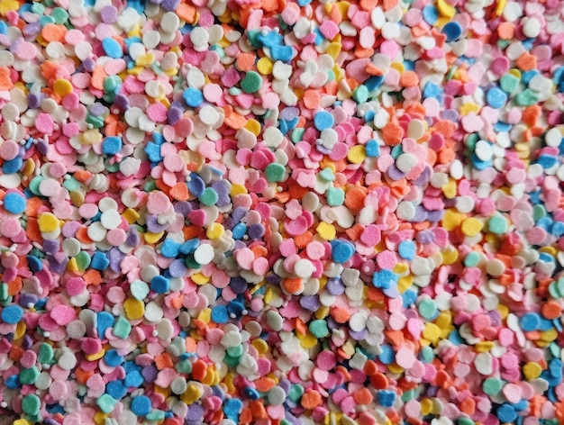 Textured background of colorful caramel confetti