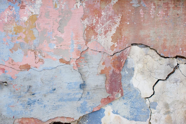 Textured background. Old concrete wall. Burgundy and blue painted