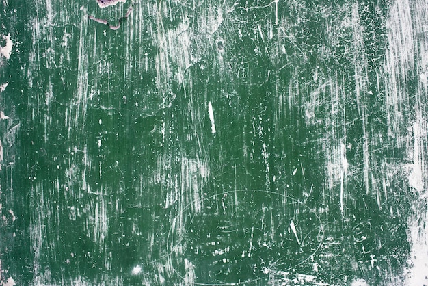 Photo the textured background. old concrete wall green with paint scratches