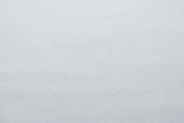 Textured background of white felt