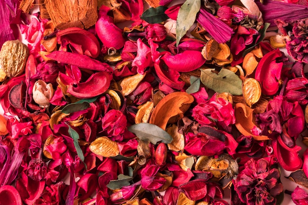 Textured Background with artificial red flowers.