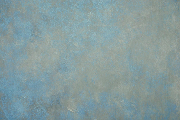 Текстурированный синий фон поцарапал шаблон структуры стены для альбома в винтажном стиле