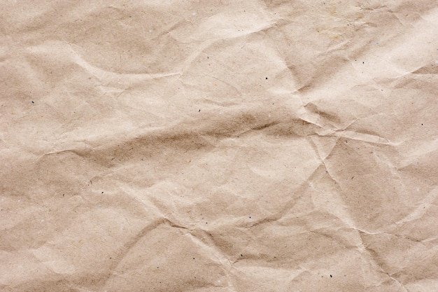 Textured brown craft paper closeup background copy space