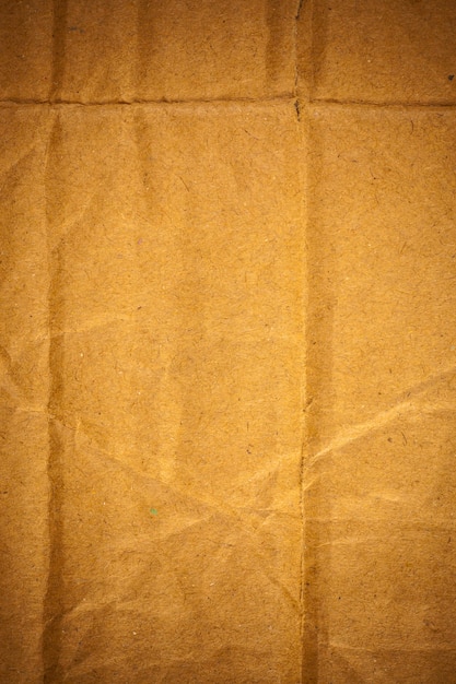 Textured crumpled brown cardboard paper background.