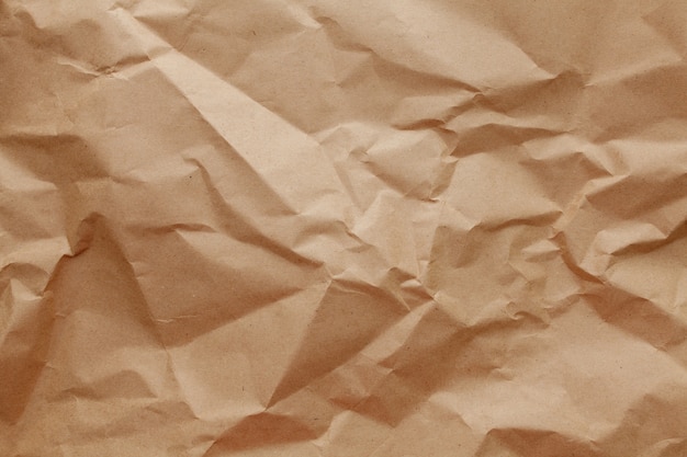 Textured crumpled packaging a brown paper background.