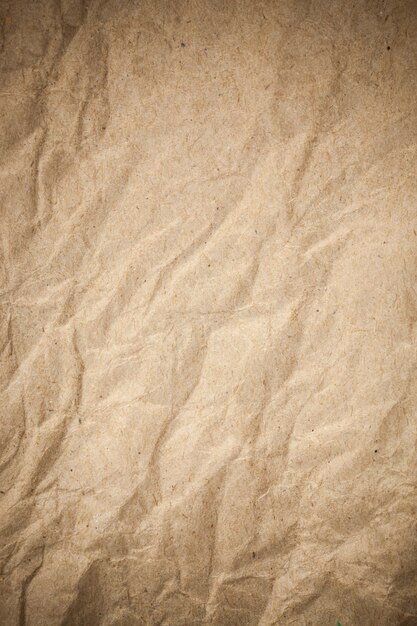 Textured crumpled packaging brown paper background.