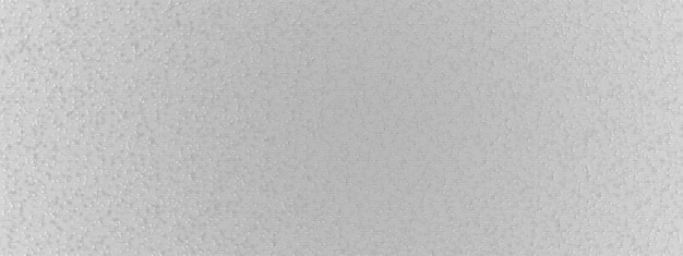 Текстурированная рельефная поверхность белой бумаги с выступающими над поверхностью мелкими кусочками и насечками