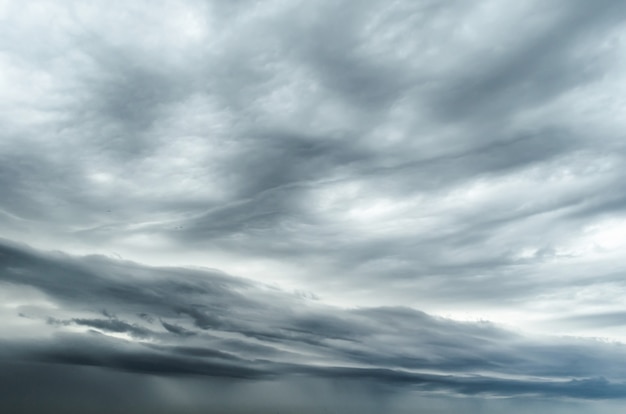 Textured gray sky before rain thunderstorm with bad weather.