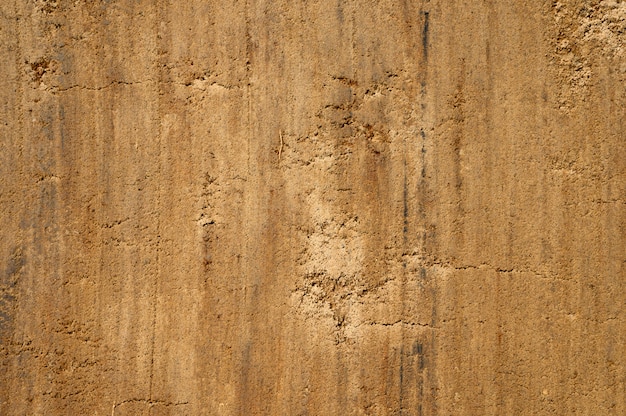 Textured ground and sand surface as background, top view