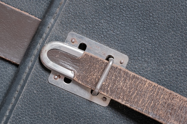 Textured leather background from fragments of an old shabby used navigator's briefcase close-up macro photography