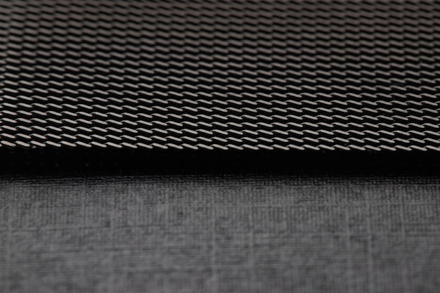 textured metal surface in dark gray color, background