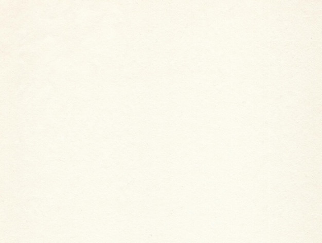 Textured pale beige coloured creative uncoated paper background