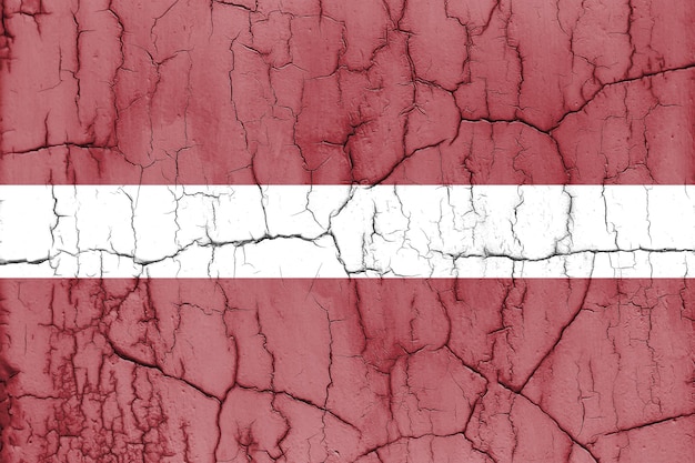 Textured photo of the flag of Latvia with cracks