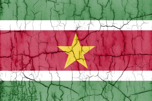Photo textured photo of the flag of suriname with cracks