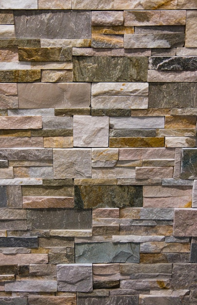 Textured stone on the wall smoothly laid out in a row with a bright texture wall decoration