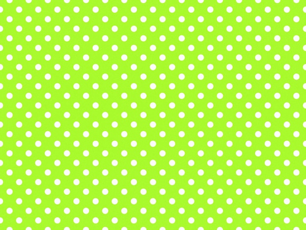 Photo texturised white color polka dots over green yellow background