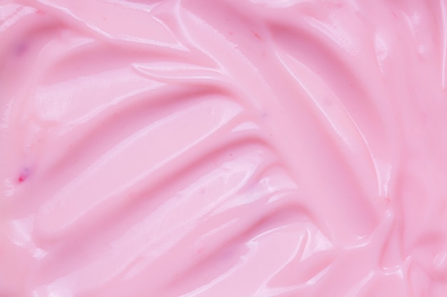 Textuur Aardbei YoghurtClose-up van de roze romige zelfgemaakte bosbessen- of aardbeienyoghurt