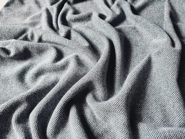Textuur en achtergrond van grijs sportkledingstofvoetbalshirt