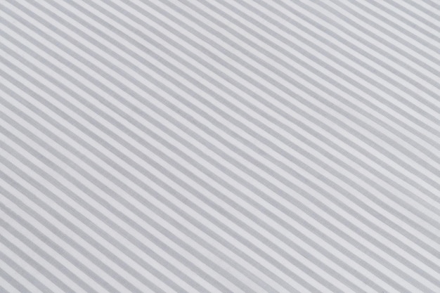 textuur gekneusd grijs en wit gestreepte katoenen stof closeup natuurlijke materialen voor het naaien van kleding achtergrond voor uw ontwerp