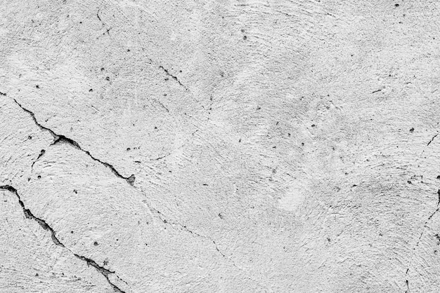 Textuur, muur, betonnen achtergrond. Muurfragment met krassen en scheuren