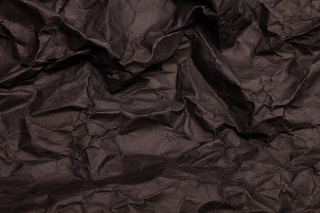 Textuur of achtergrond van gedetailleerd zwart getint verfrommeld papier