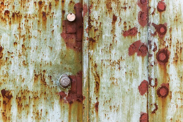 Foto textuur roestige ijzeren poort