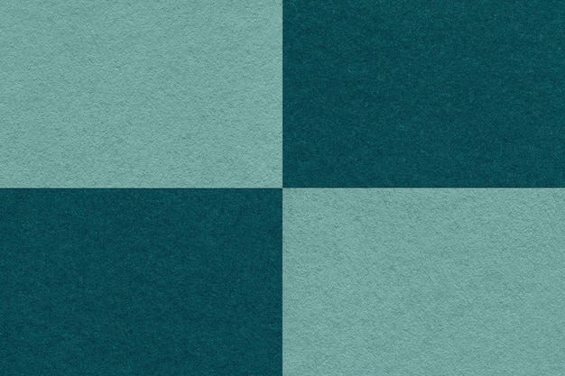 Textuur van ambachtelijk cyaan en smaragdgroen papier achtergrond met cellen patroon macro Vintage dicht kraft groenblauw karton