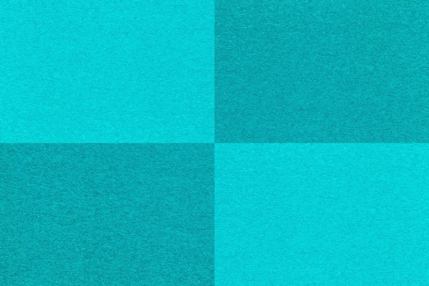 Textuur van ambachtelijke cyaan en cerulean papier achtergrond met cellen patroon macro Structuur van vintage turquoise karton