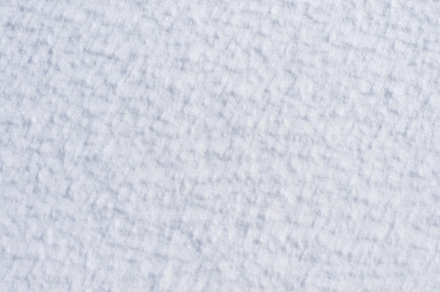 Textuur van de sneeuw op een zonnige dag