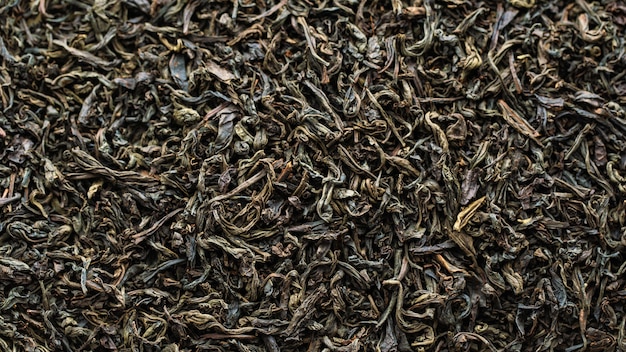 Textuur van droge zwarte theebladeren
