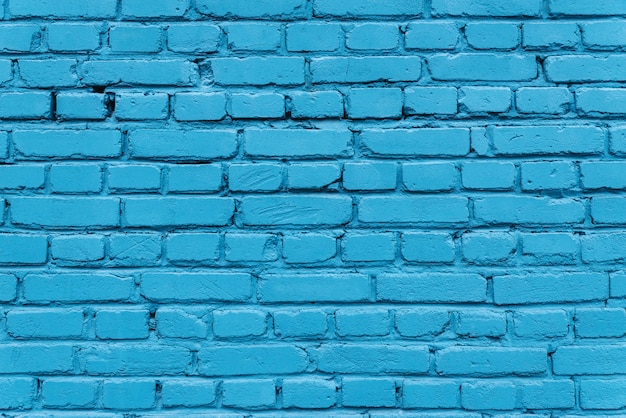 Textuur van een blauwe bakstenen muur van een huis.