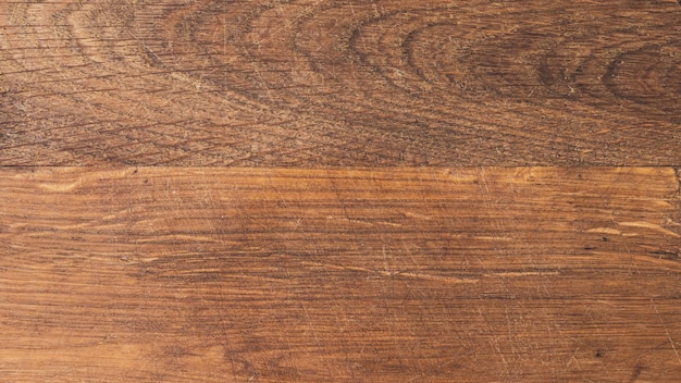 Textuur van een oud bruin houten bord met krassen eikenhout