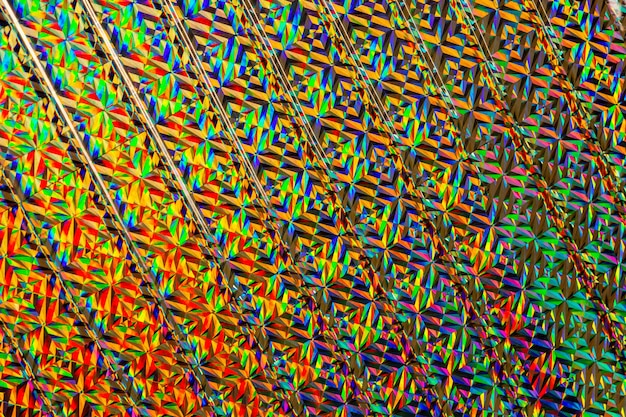 Textuur van gekleurde folie met holografisch effect Kerstmis Nieuwjaar vakantiefestival