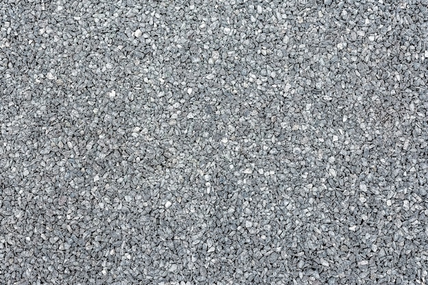 Textuur van grijze gebroken steen of puin als natuurlijke achtergrond