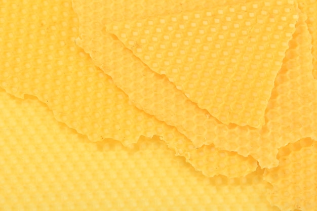 Foto textuur van honingraat. heldere gele honing achtergrond. honing cellen.