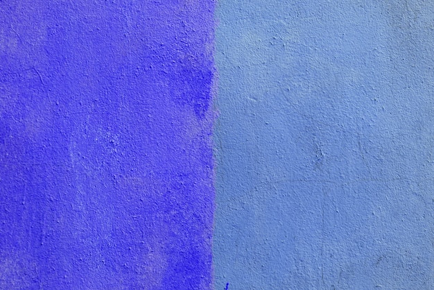 Textuur van ruw blauw en violet gips. Architecturale abstracte achtergrond.