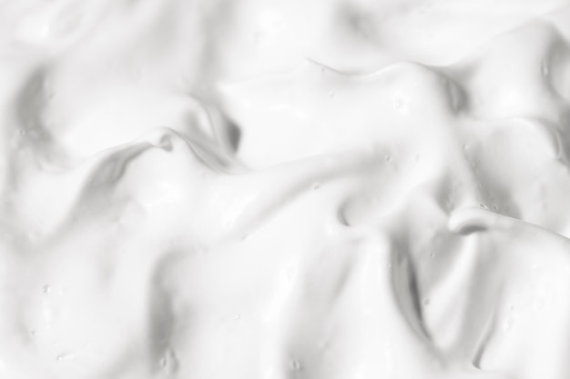 Foto textuur van witte cosmetische crème bovenaanzicht facial lotion huidverzorging patroon schoonheid