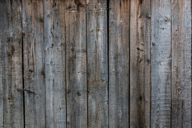 Textuurachtergrond van oude grijze verticaal geschikte planken